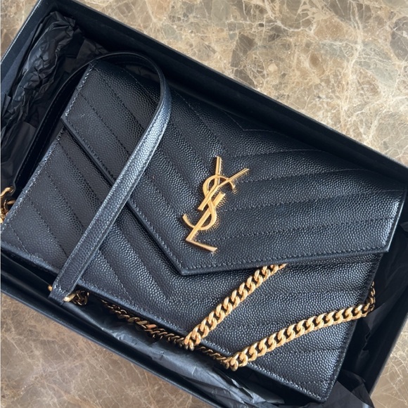 Yves Saint Laurent Handbags - Yves Saint Laurent Black Chevron Clutch with Gold Accents